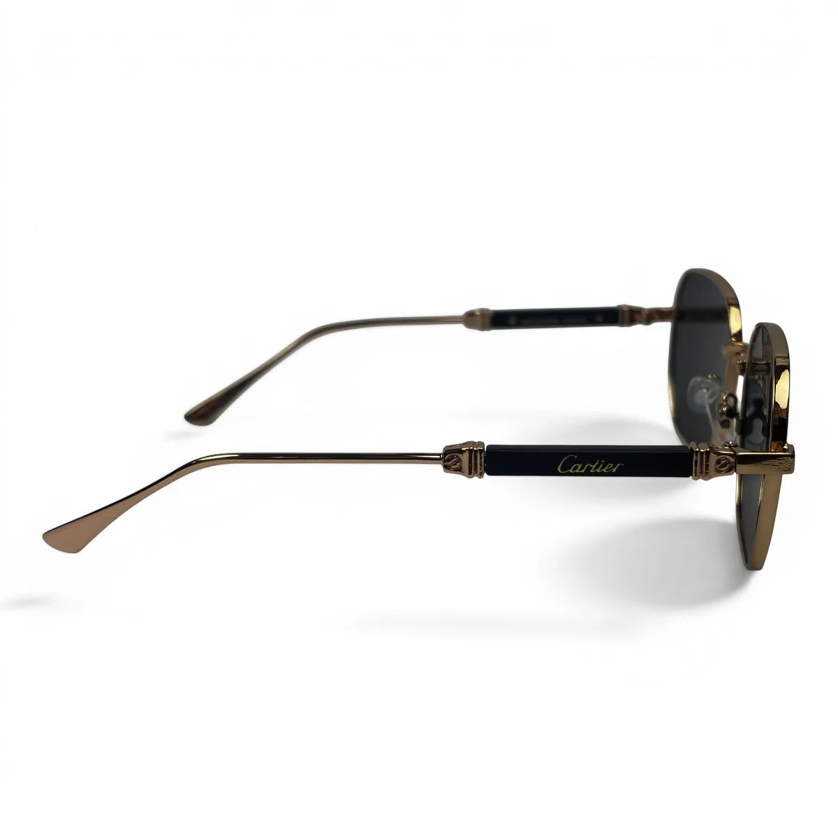 The Aurel geometric sunglasses in gold and brown with dark gray lenses, side profile view