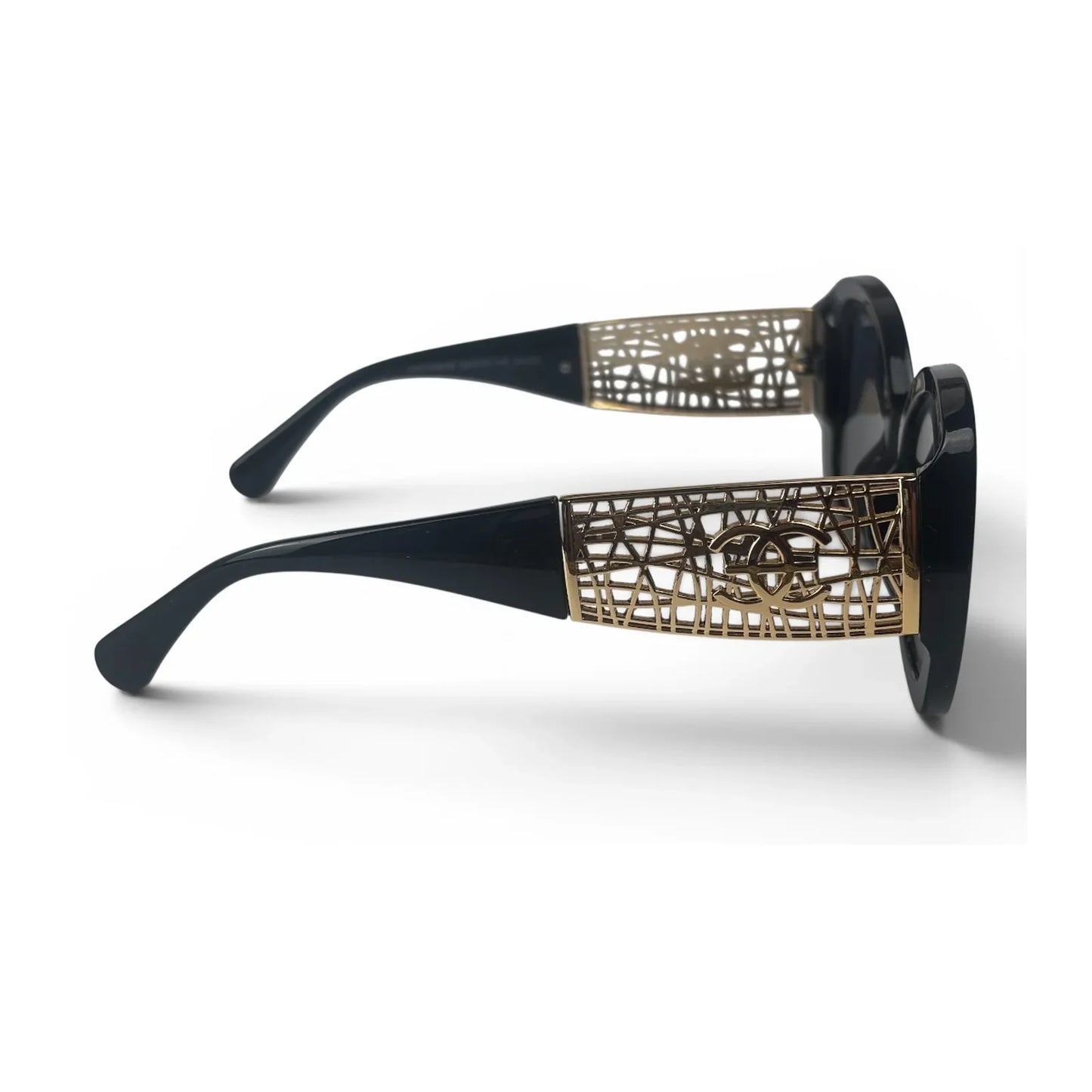 The Filigree oversized round sunglasses in black gold with dark gray lenses, side view