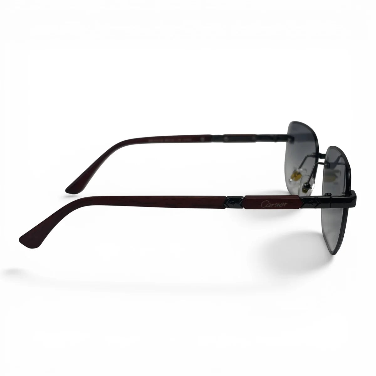 The Auren Rimless Geometric sunglasses in Black Burgundy with Gray Gradient lenses, side profile view