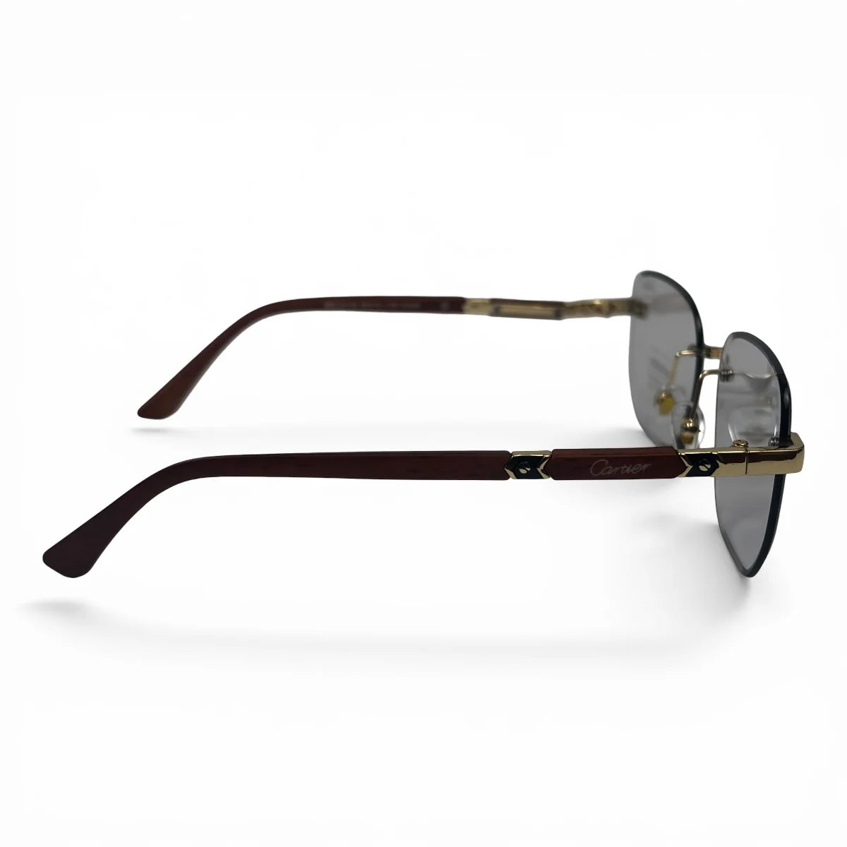 The Auren Rimless Geometric sunglasses in Gold Burgundy with Silver Gradient lenses, side profile view