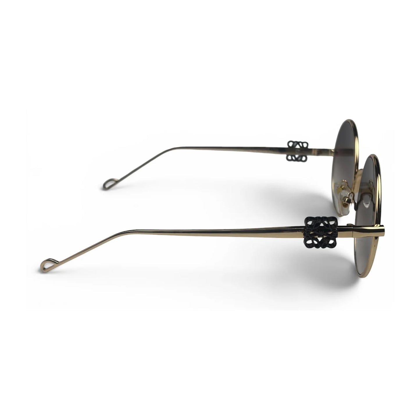 The Liora Round sunglasses in Gold with Brown Gradient lenses, side profile view