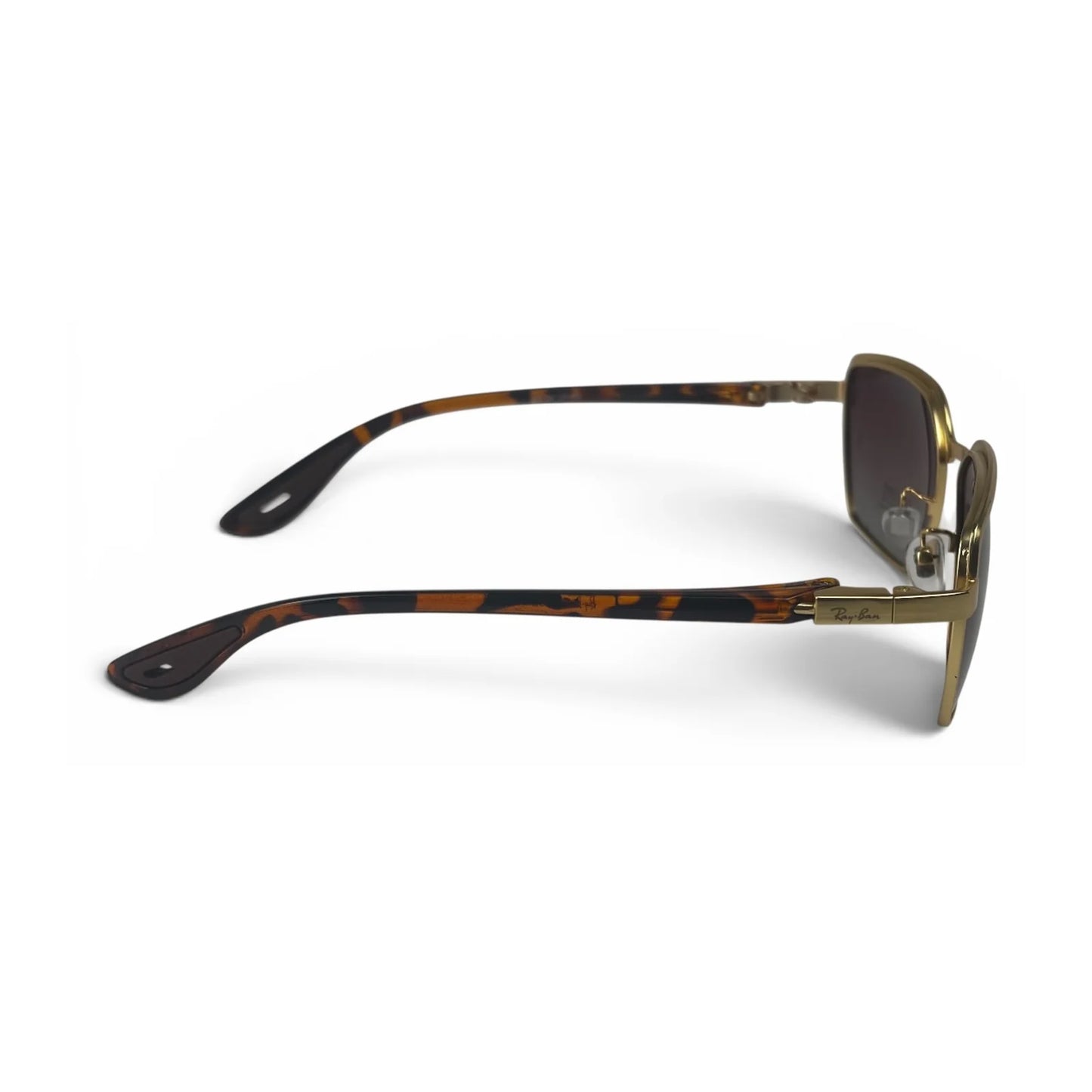 The Vector Rectangle sunglasses in Gold Tortoise with Brown Gradient lenses, side profile view