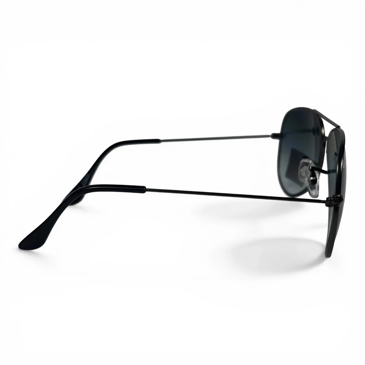 The Vela aviator sunglasses in gunmetal with blue gradient lenses, side profile view