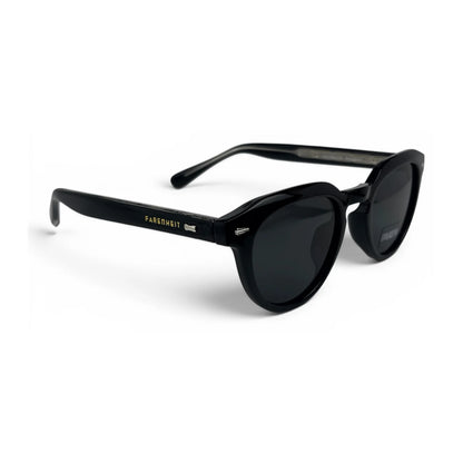 U&EYE The Nomad keyhole round polarized sunglasses in Polished Black and Dark Grey — angled view