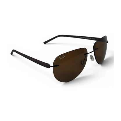 The Phantom rimless aviator sunglasses in Espresso Brown, angled three-quarter view