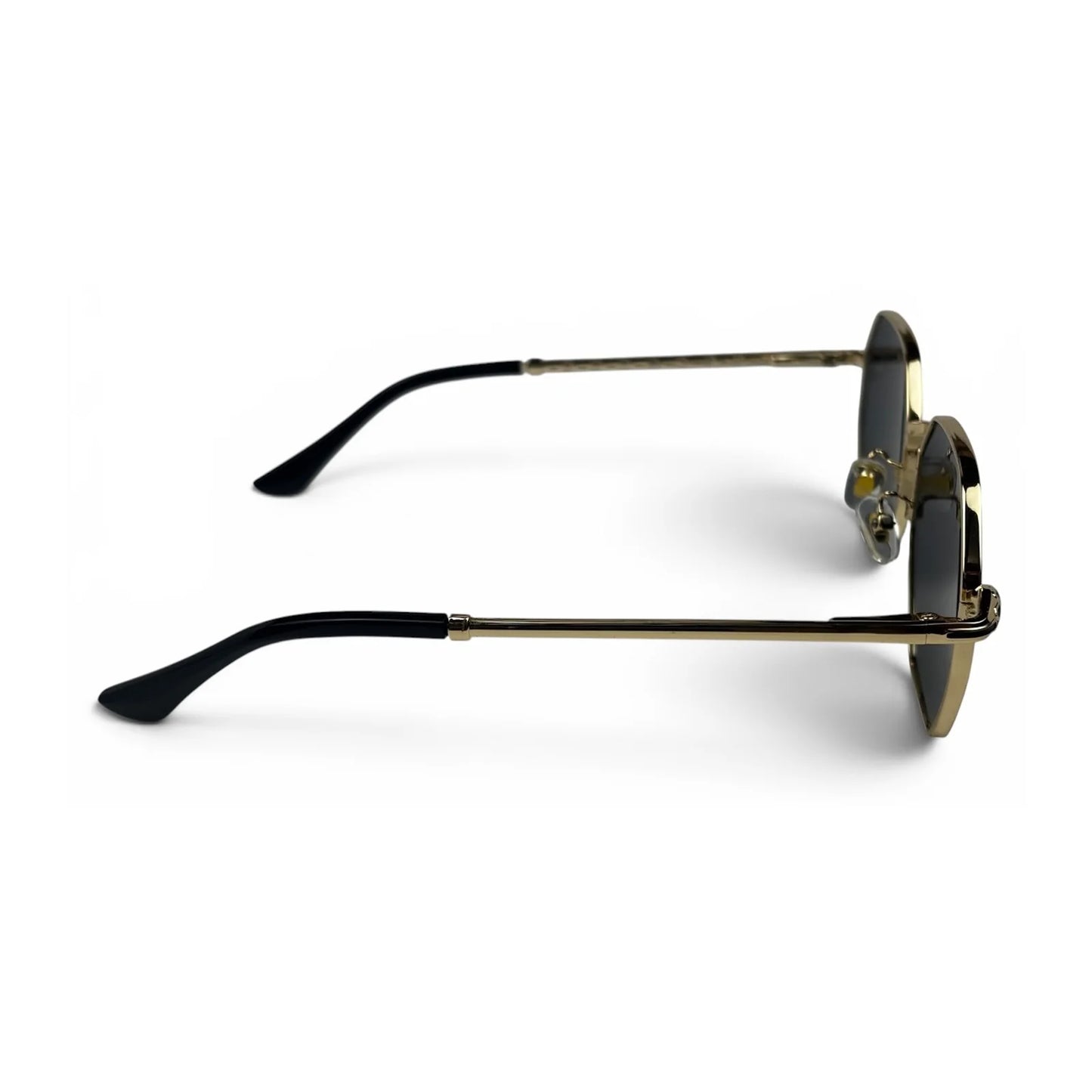 The Facet geometric rimless sunglasses in gold and black with black lenses, side profile view