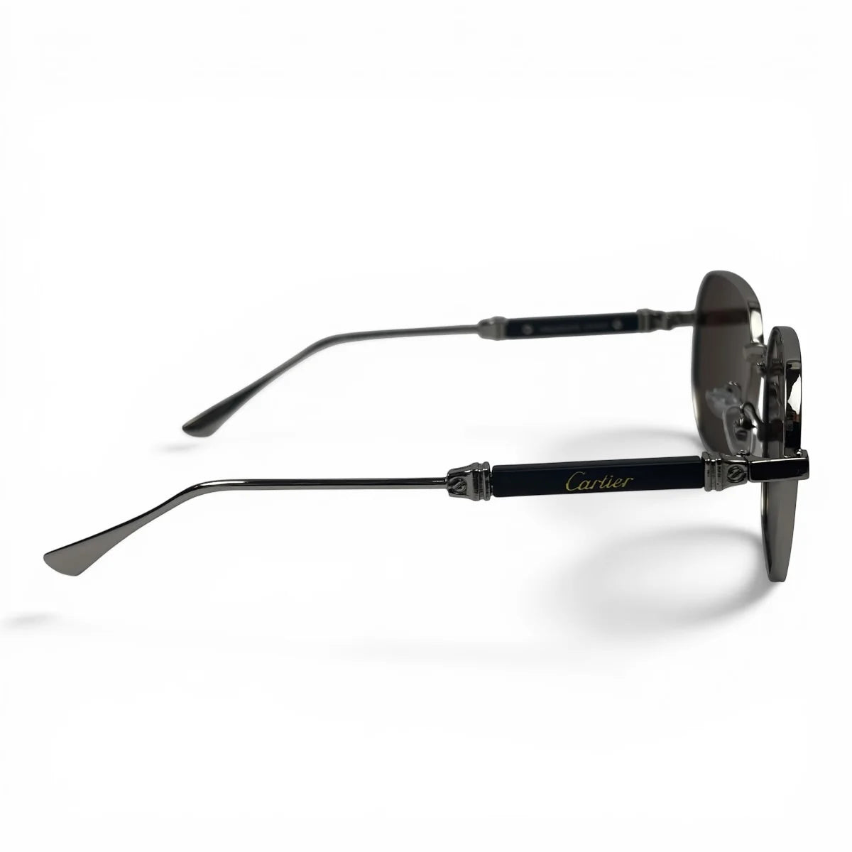 The Aurel geometric sunglasses in black and silver with brown lenses, side profile view