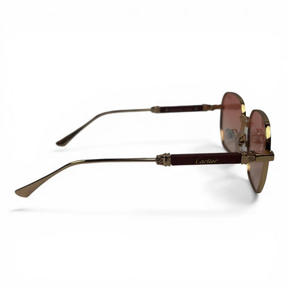 The Aurel geometric sunglasses in gold and brown with rose gradient lenses, side profile view