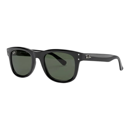 Black sunglasses with green lenses on a white background