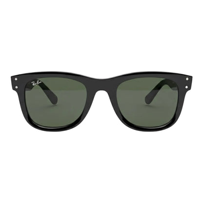 Black sunglasses with green lenses on a white background