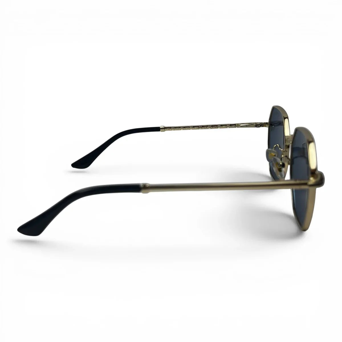 The Facet geometric rimless sunglasses in gold and black with blue lenses, side profile view