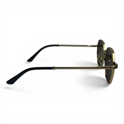 The Facet geometric rimless sunglasses in gold and black with brown lenses, side profile view