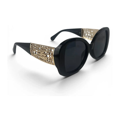 The Filigree oversized round sunglasses in black gold with dark gray lenses, angled view