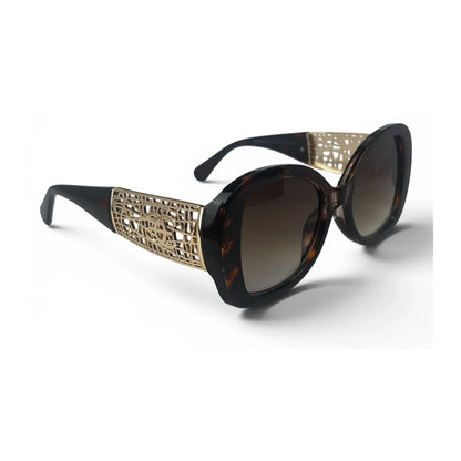 The Filigree oversized round sunglasses in tortoise gold with olive lenses, angled view
