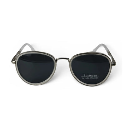 The Lumen round sunglasses in clear with black lenses, straight front view