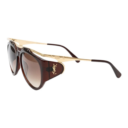 Sunglasses with gold frame and brown lenses on a white background