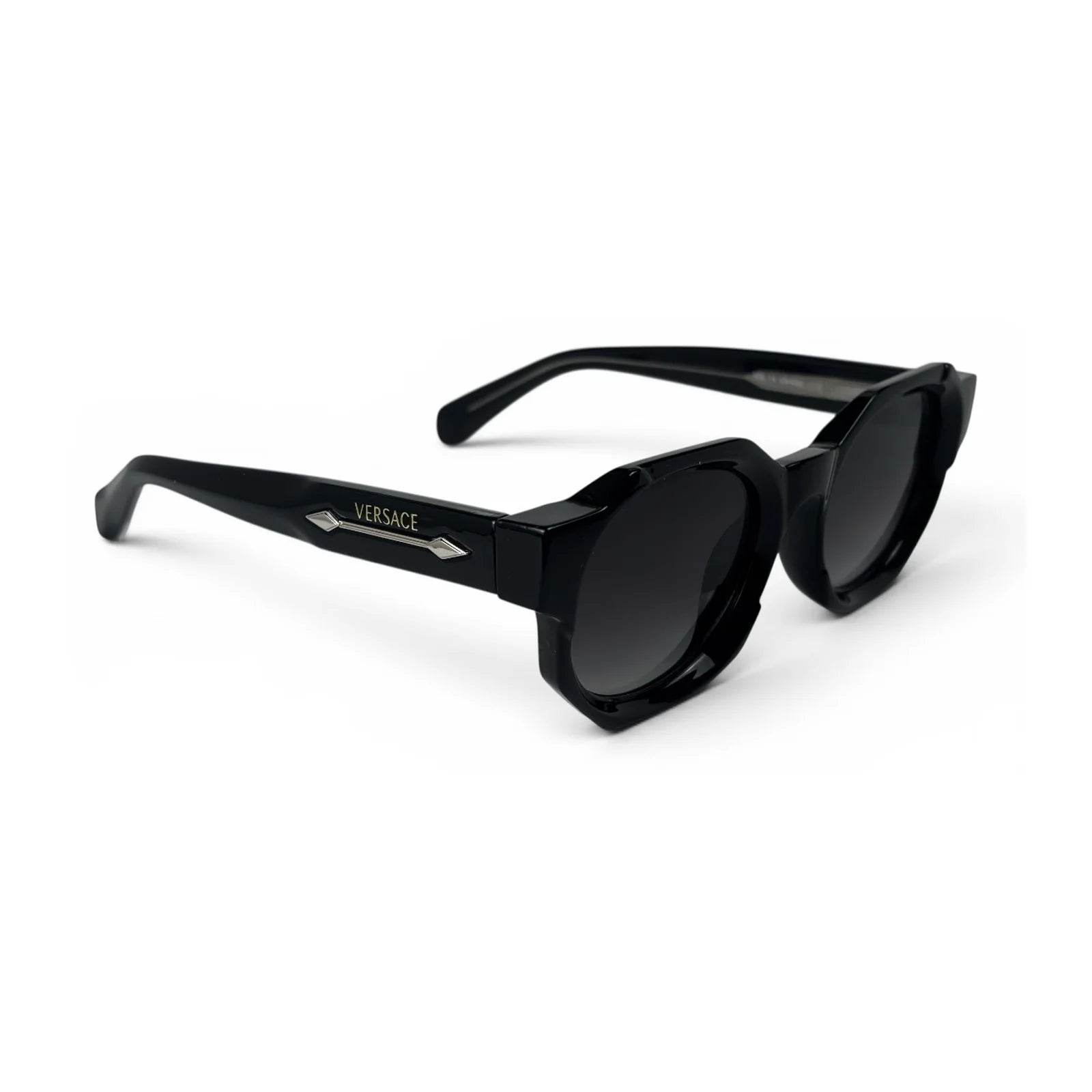 The Monolith chunky octagon sunglasses in black with gradient black lenses, angled view