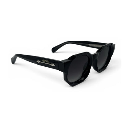 The Monolith chunky octagon sunglasses in black with gradient black lenses, angled view