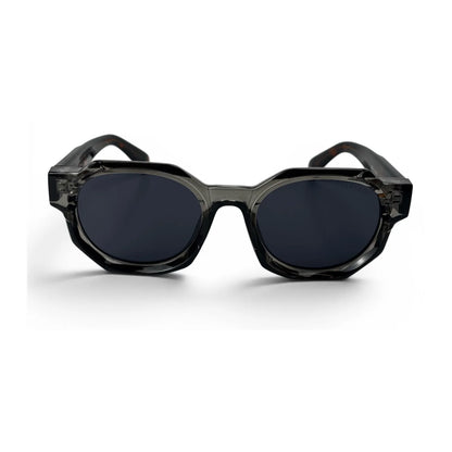 The Monolith chunky octagon sunglasses in smoke gray with tortoise temples and dark gray lenses, front view