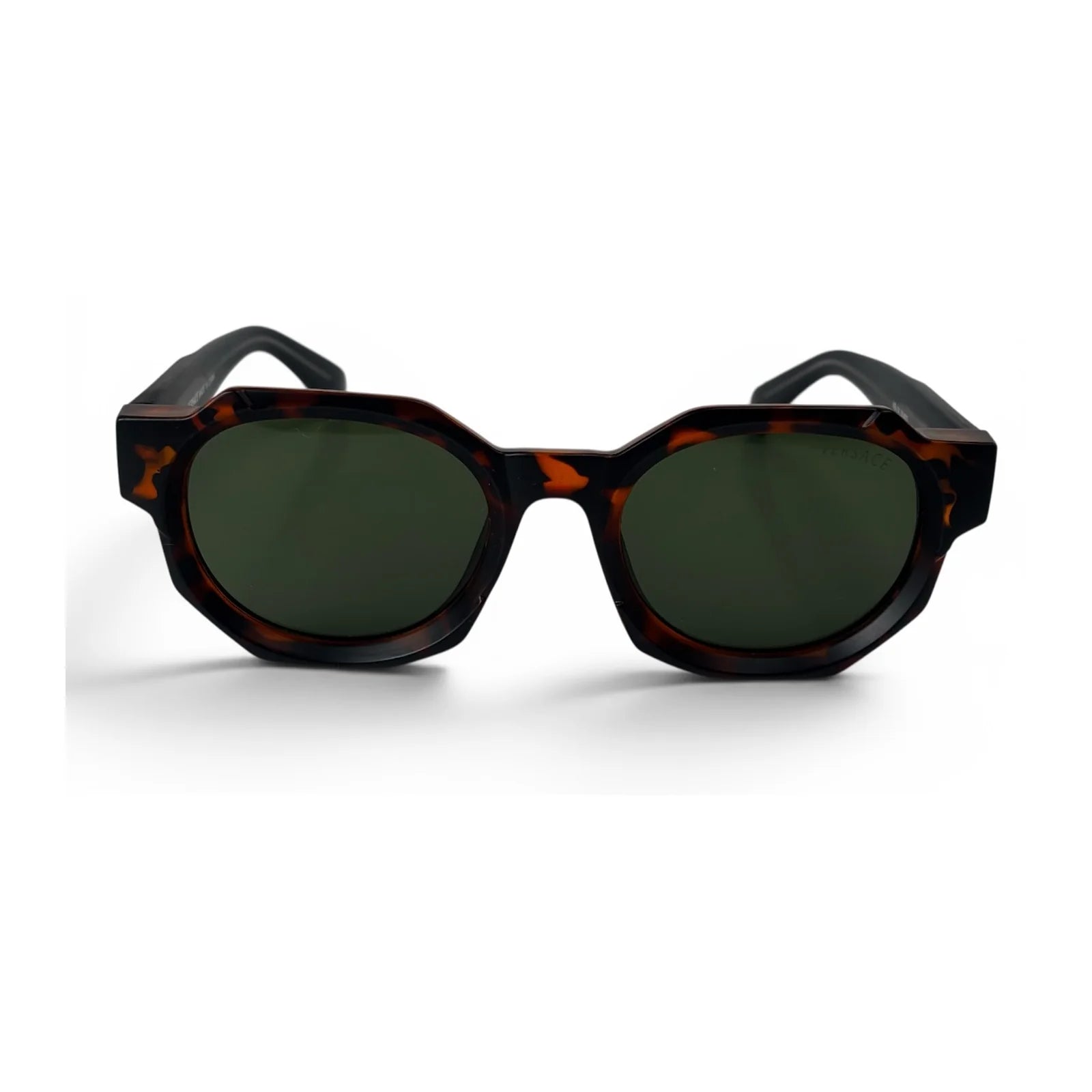 The Monolith chunky octagon sunglasses in tortoise with olive lenses, front view