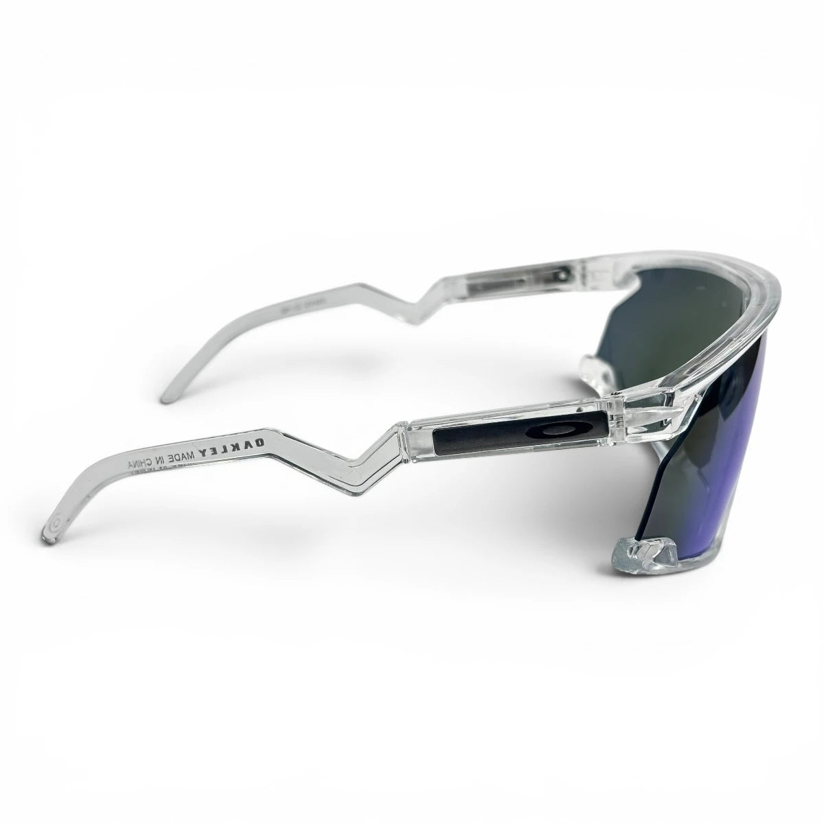 The Aero Sport Shield sunglasses in Clear with Blue Mirror lenses, side profile view