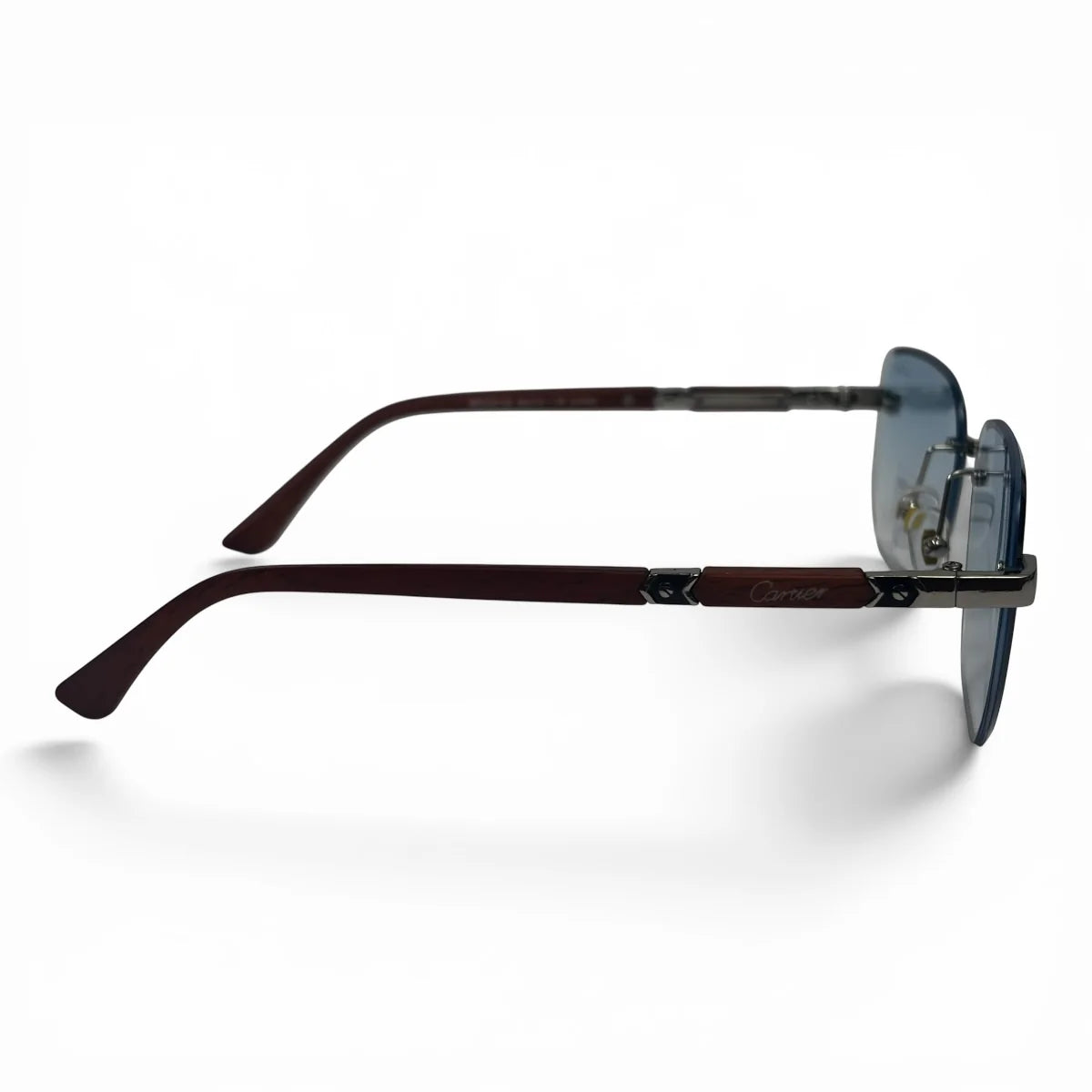 The Auren Rimless Geometric sunglasses in Gold Burgundy with Blue Gradient lenses, side profile view