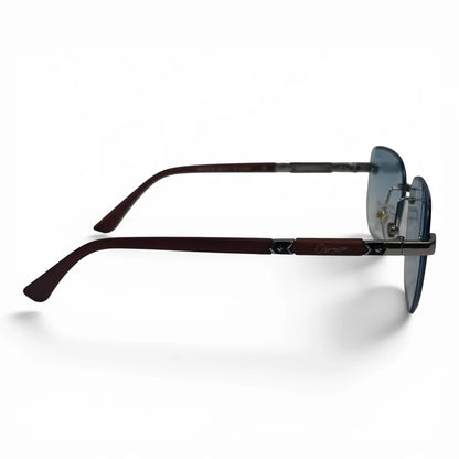 The Auren Rimless Geometric sunglasses in Gold Burgundy with Blue Gradient lenses, side profile view
