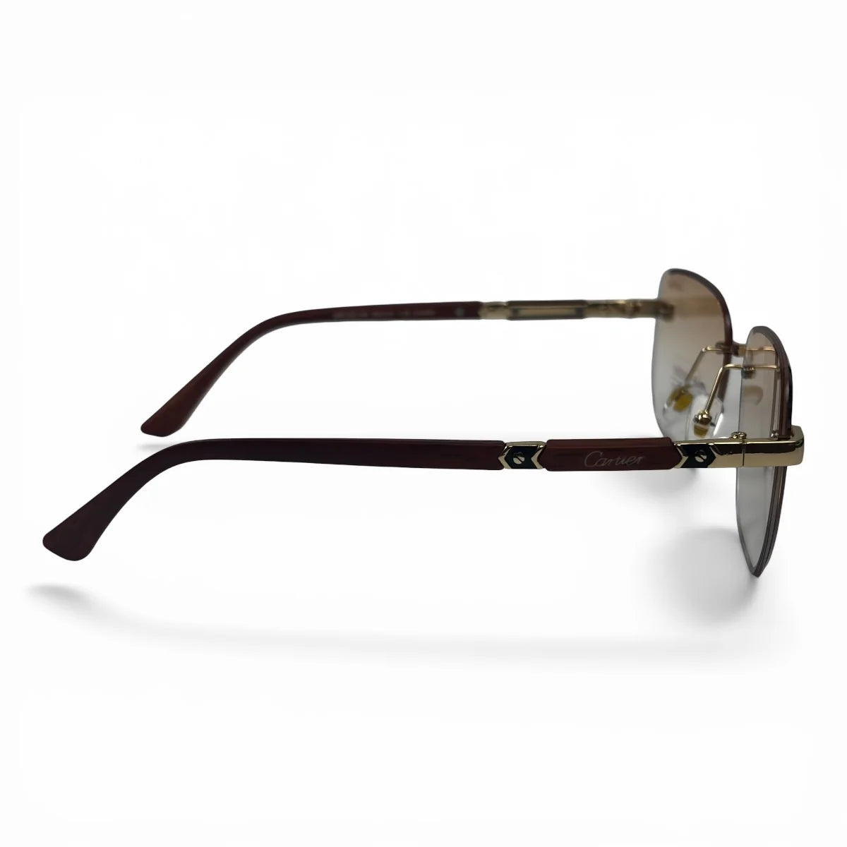 The Auren Rimless Geometric sunglasses in Gold Burgundy with Champagne Gradient lenses, side profile view