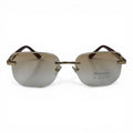 The ‘Auren’ Rimless Geometric Sunglasses | Gold Burgundy Champagne