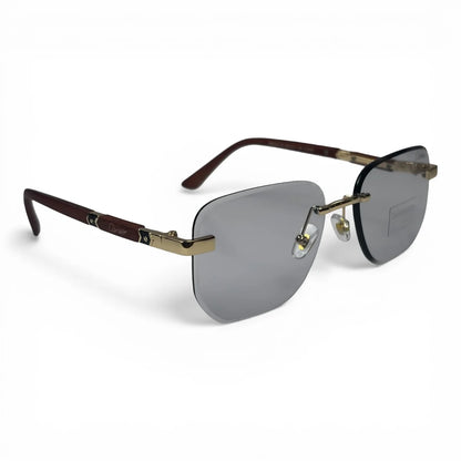 The Auren Rimless Geometric sunglasses in Gold Burgundy with Silver Gradient lenses, angled three-quarter view