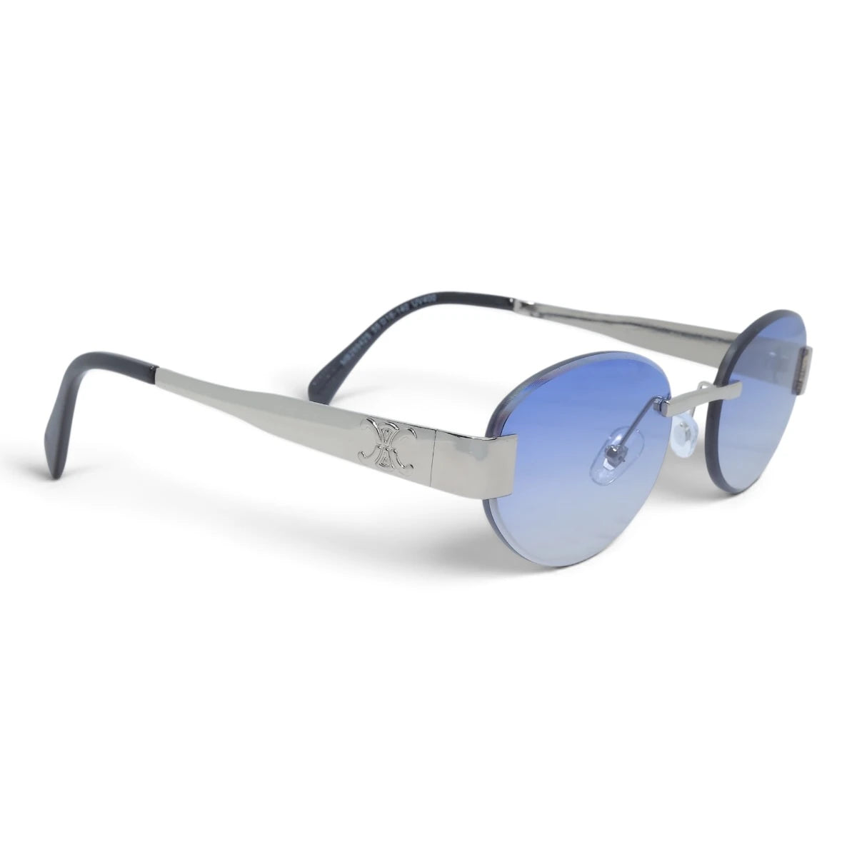 U&EYE The Celeste rimless oval sunglasses in Silver / Light Blue Gradient — angled view