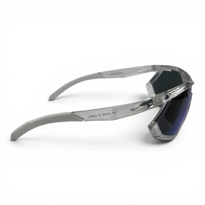 The Glide Sport Shield sunglasses in Clear with Blue Mirror lenses, side profile view