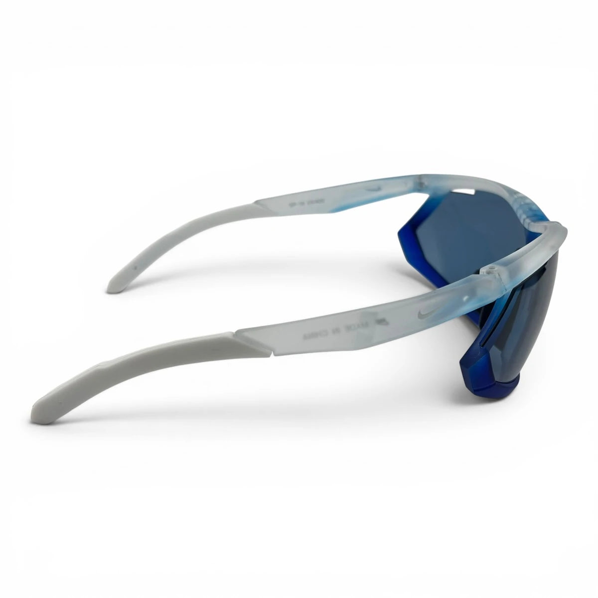 The Glide Sport Shield sunglasses in White with Blue lenses, side profile view