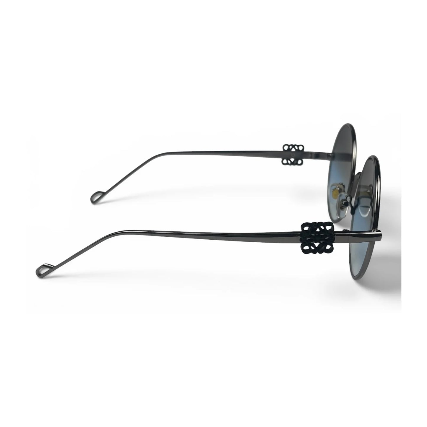 The Liora Round sunglasses in Black with Blue Gradient lenses, side profile view
