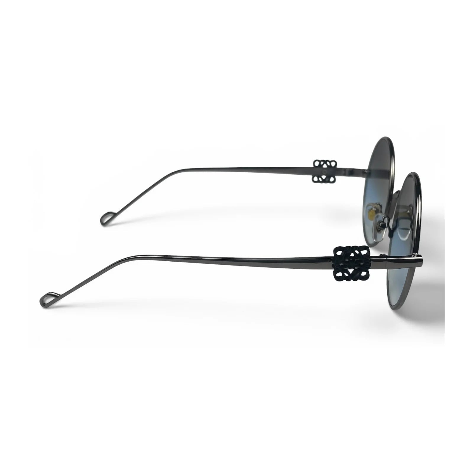 The Liora Round sunglasses in Black with Blue Gradient lenses, side profile view