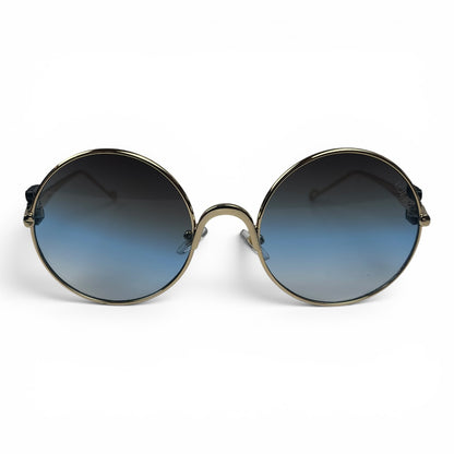 The Liora Round sunglasses in Gold with Blue Gradient lenses, straight front view