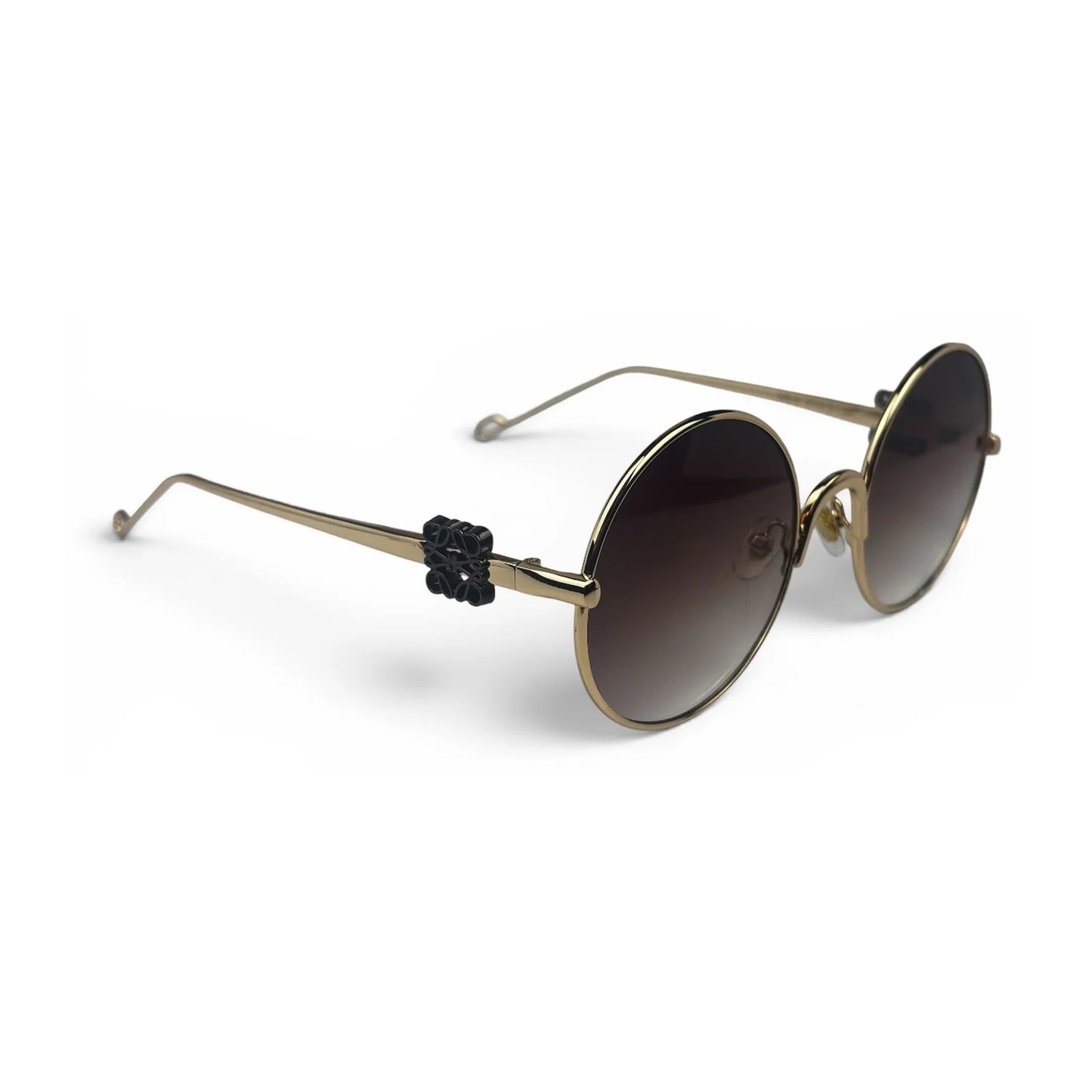 The Liora Round sunglasses in Gold with Brown Gradient lenses, angled three-quarter view