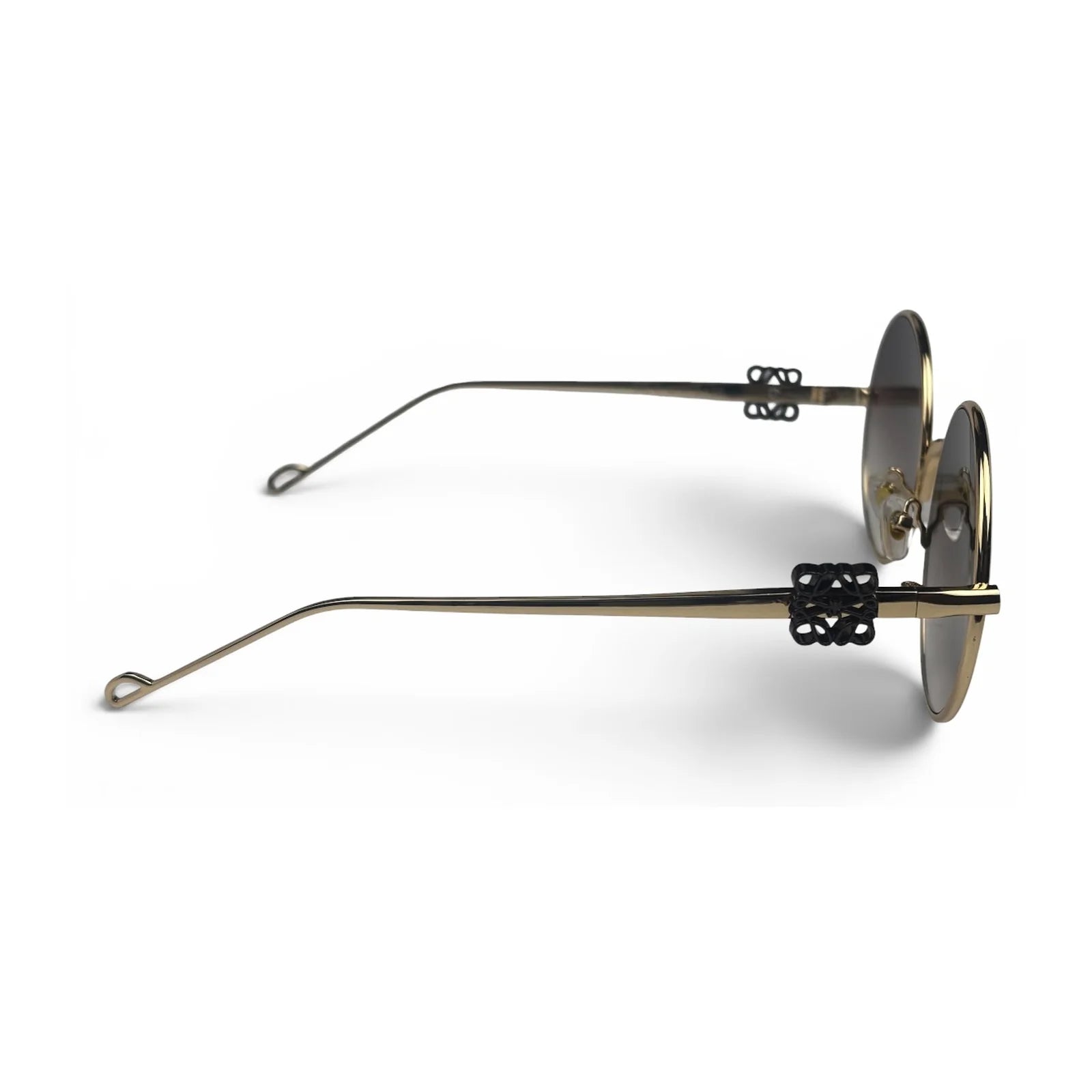 The Liora Round sunglasses in Gold with Brown Gradient lenses, side profile view