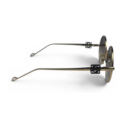 The Liora Round sunglasses in Gold with Brown Gradient lenses, side profile view