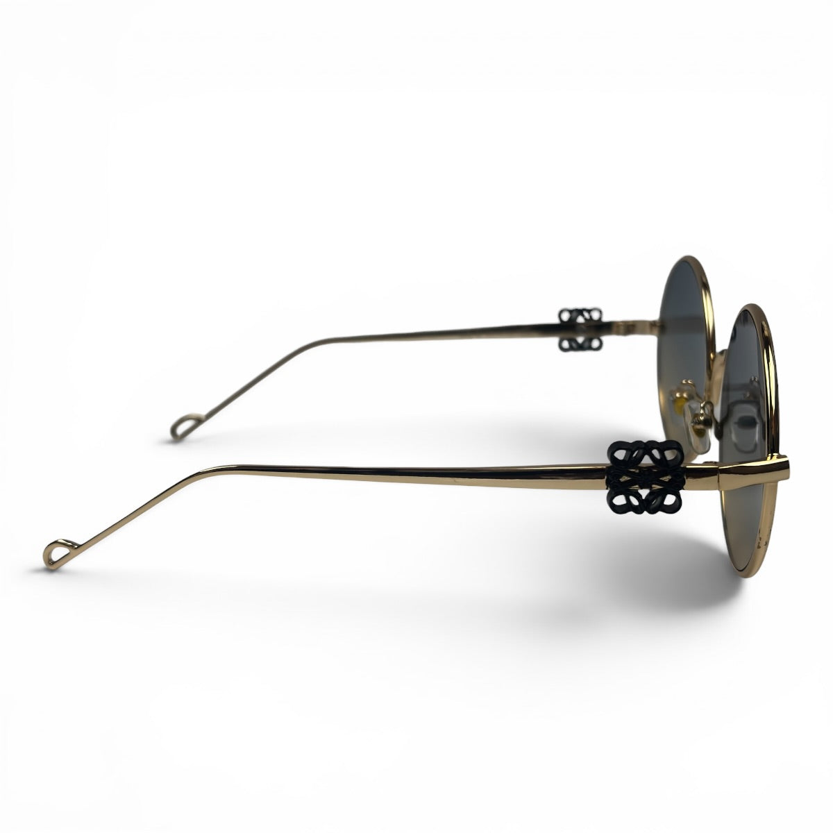 The Liora Round sunglasses in Gold with Green Gray lenses, side profile view