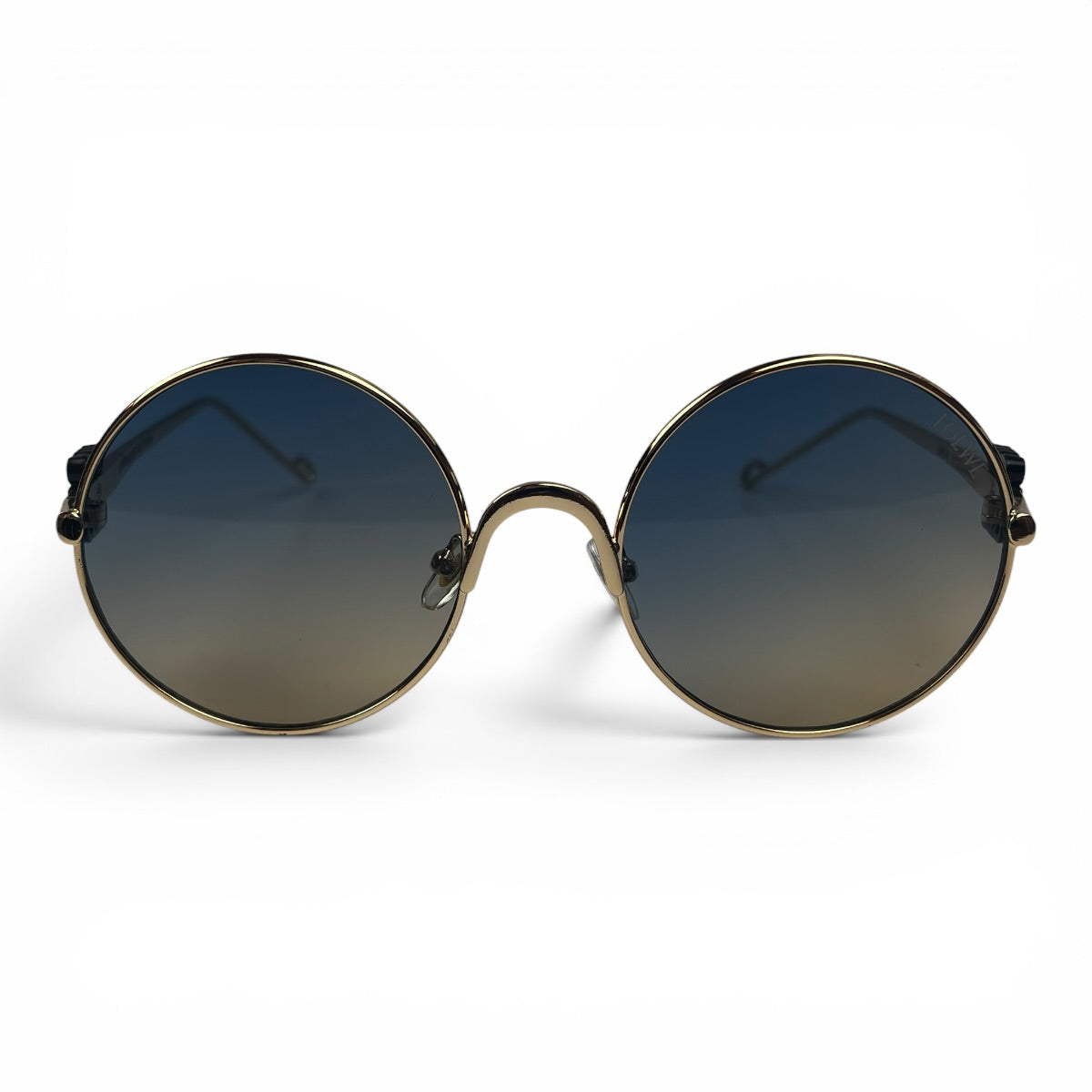The Liora Round sunglasses in Gold with Green Gray lenses, straight front view