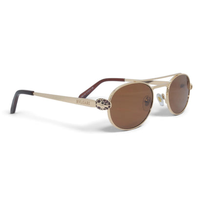 U&EYE The Lysandre small oval sunglasses in Gold / Brown — angled view