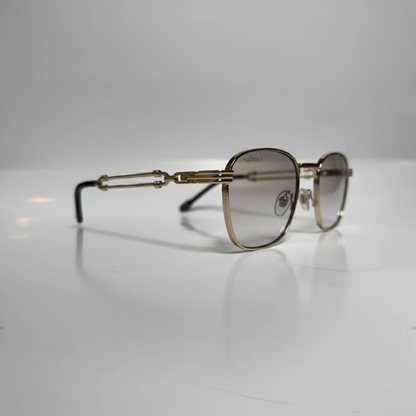 Transparent gold rectangle sunglasses with brown gradient lenses, angled view