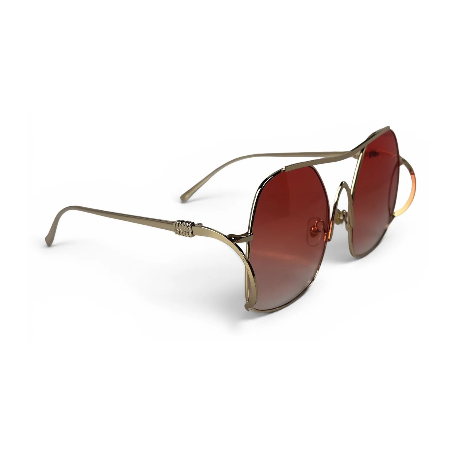 The Solene Oversized Square sunglasses in Gold with Rose Gradient lenses, angled three-quarter view
