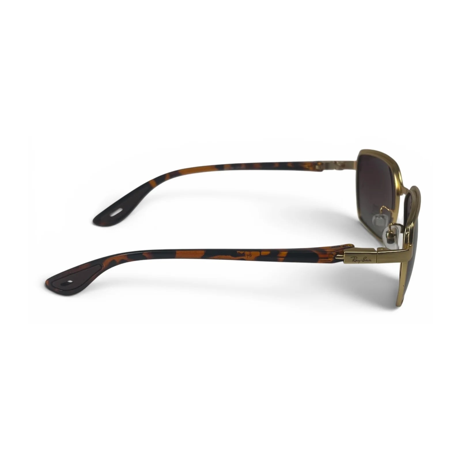 The Vector Rectangle sunglasses in Gold Tortoise with Brown Gradient lenses, side profile view