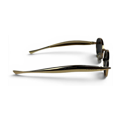 The Aveline oval sunglasses in gold with black lenses, side profile view