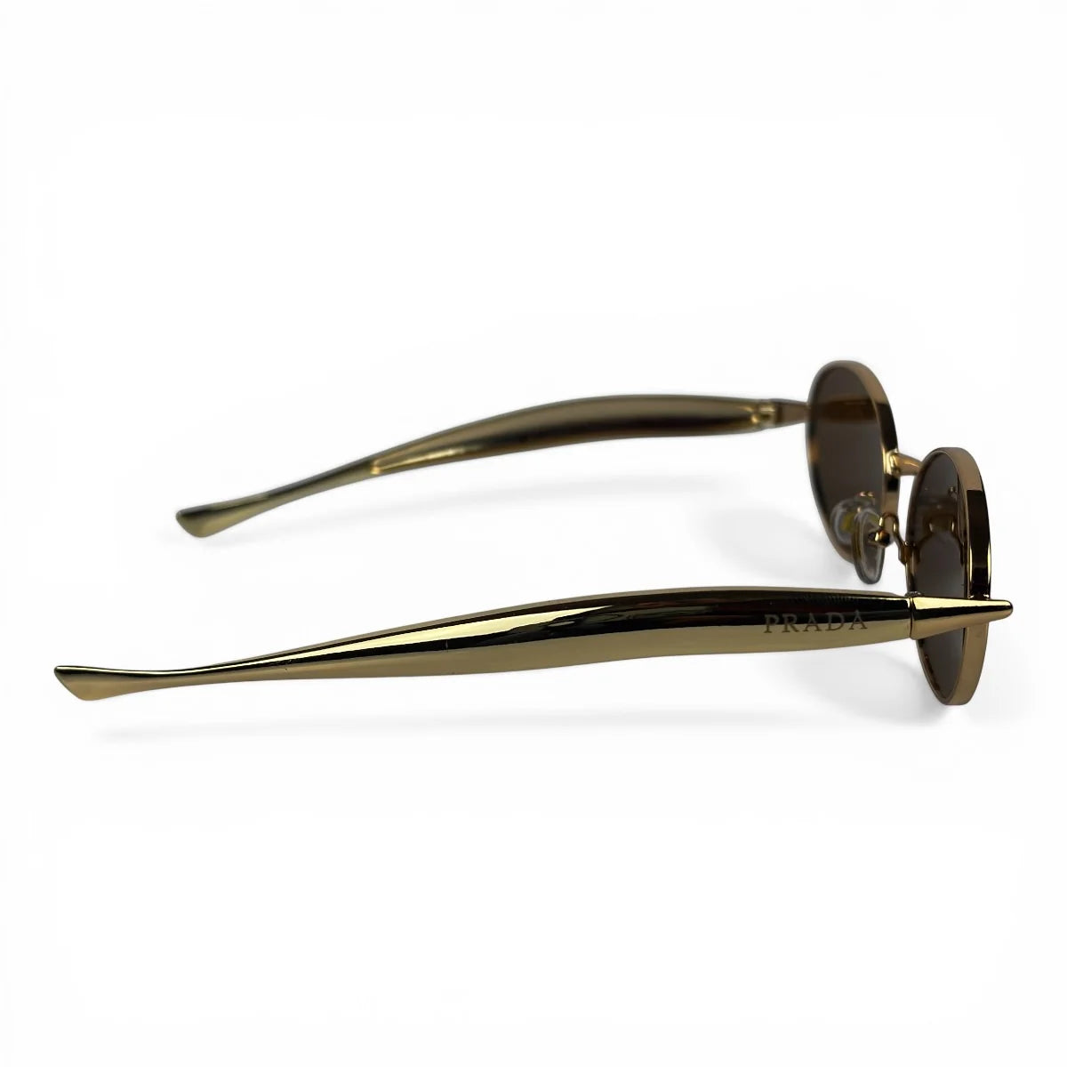 The Aveline oval sunglasses in gold with brown lenses, side profile view