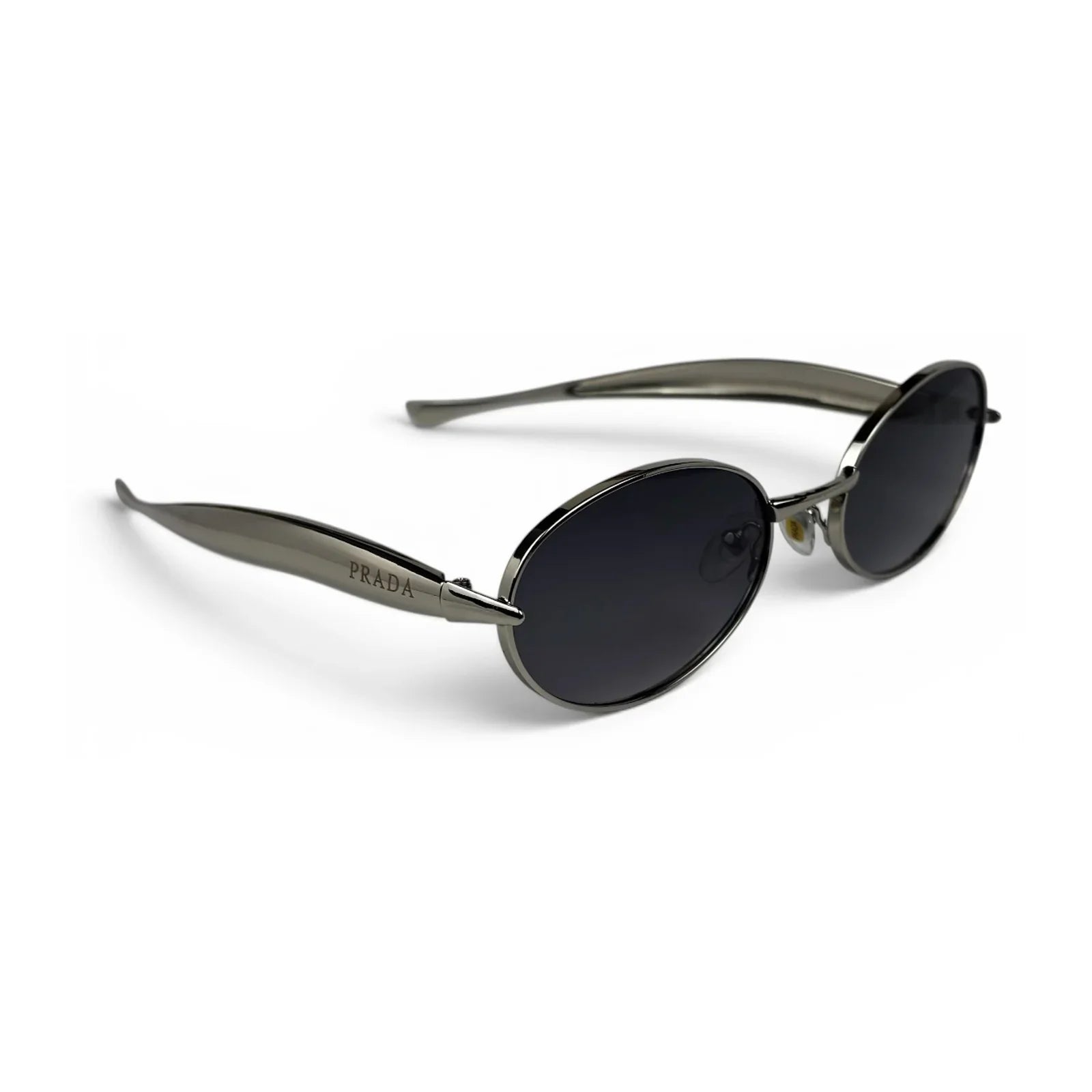 The Aveline oval sunglasses in silver with black lenses, angled three-quarter view