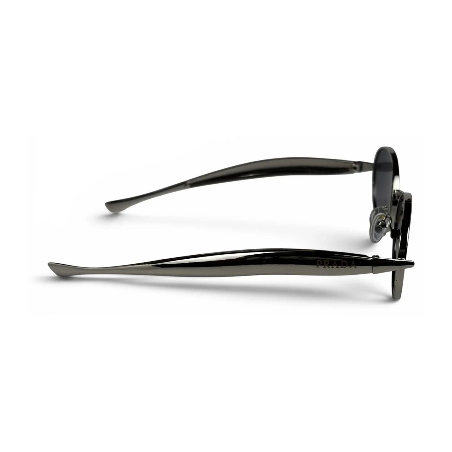 The Aveline oval sunglasses in silver with black lenses, side profile view
