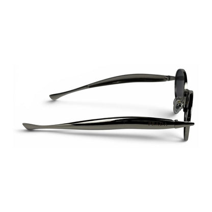 The Aveline oval sunglasses in silver with black lenses, side profile view